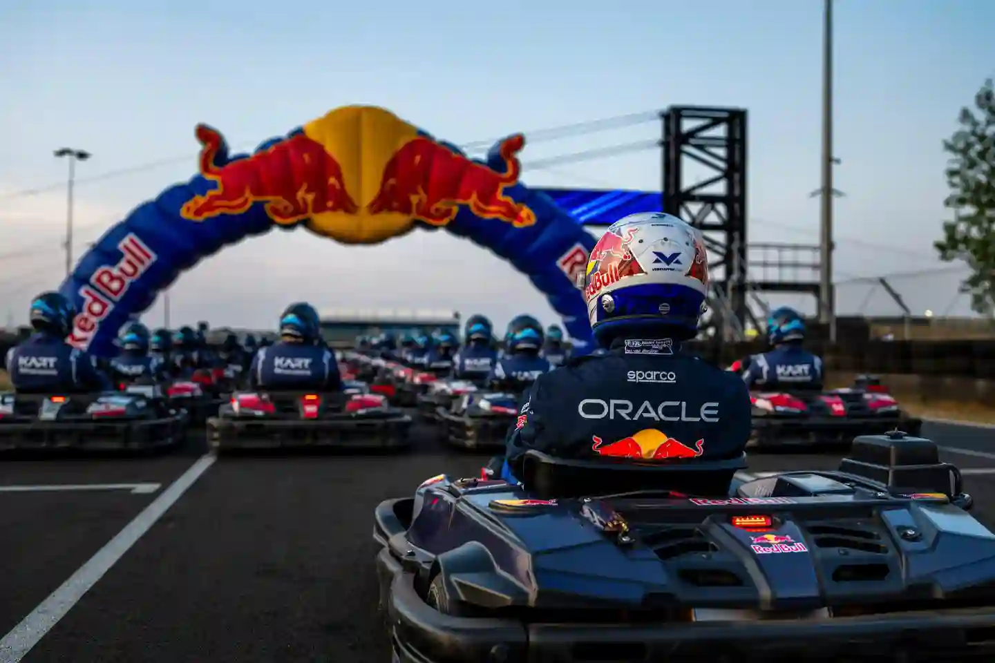 Max Verstappen lines up behind 100 drivers at the start of the Max vs 100 karting challenge